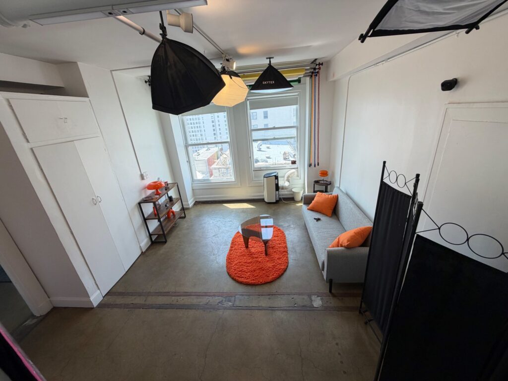Burrito Studio: interview set with sofa, windows and Historic Core views